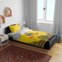 Yellow rugby bedding set on bed: 00 emblem and YOUR TEXT with patterned bottom edge
