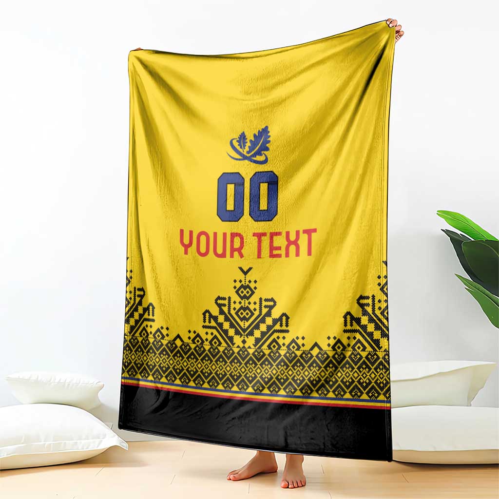Yellow rugby-style blanket with blue emblem, '00', and 'YOUR TEXT' over black hem.