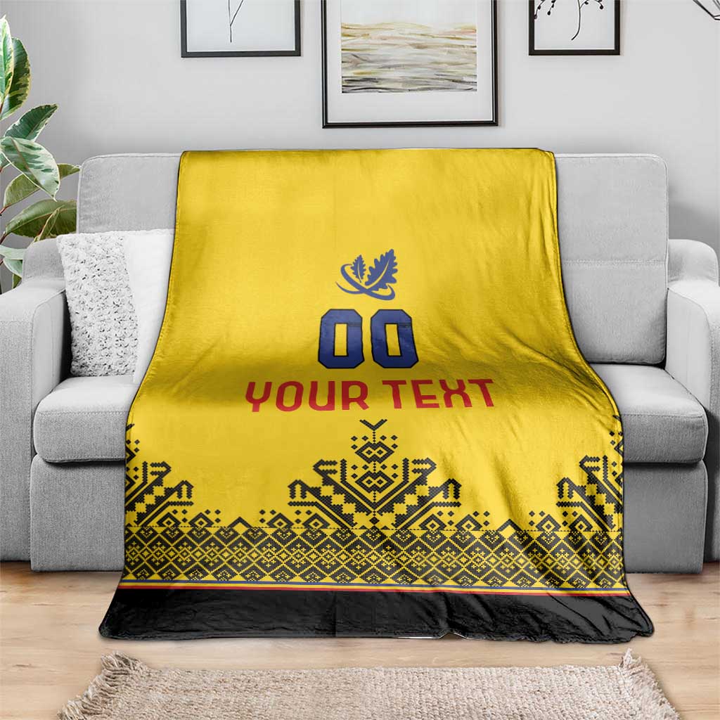 Yellow rugby blanket with blue crest, '00' and 'YOUR TEXT', patterned trim and black base.