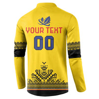 Back of yellow rugby button sweatshirt with blue crest, YOUR TEXT 00, and patterned hem