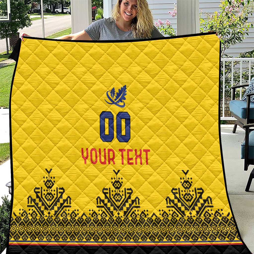Yellow quilt with diamond stitching, blue "00" emblem, "YOUR TEXT" and patterned black trim
