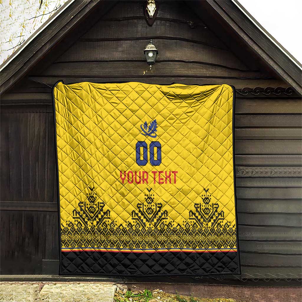 Yellow quilt hanging on wooden wall, diamond quilting, blue crest, "YOUR TEXT" and black border