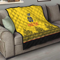 Yellow quilt on a sofa, diamond quilting, blue crest, "YOUR TEXT" and black patterned bottom