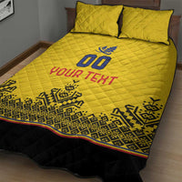 Yellow quilt bed set with 2 pillows, '00' and 'YOUR TEXT' on quilt, bold geometric edge