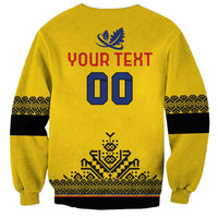 Yellow rugby sweatshirt back with YOUR TEXT 00 print, leaf crest, and patterned hem panel