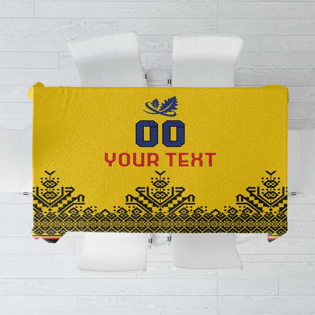 Yellow tablecloth design flat lay with blue crest, “Your Text,” and patterned trim.
