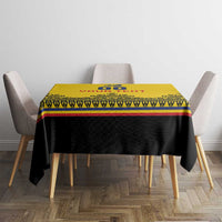Yellow and black rugby-style tablecloth with red and blue trim, centered on a dining table.