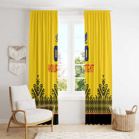 Yellow window curtains with blue crest, red text, and black geometric pattern at bottom