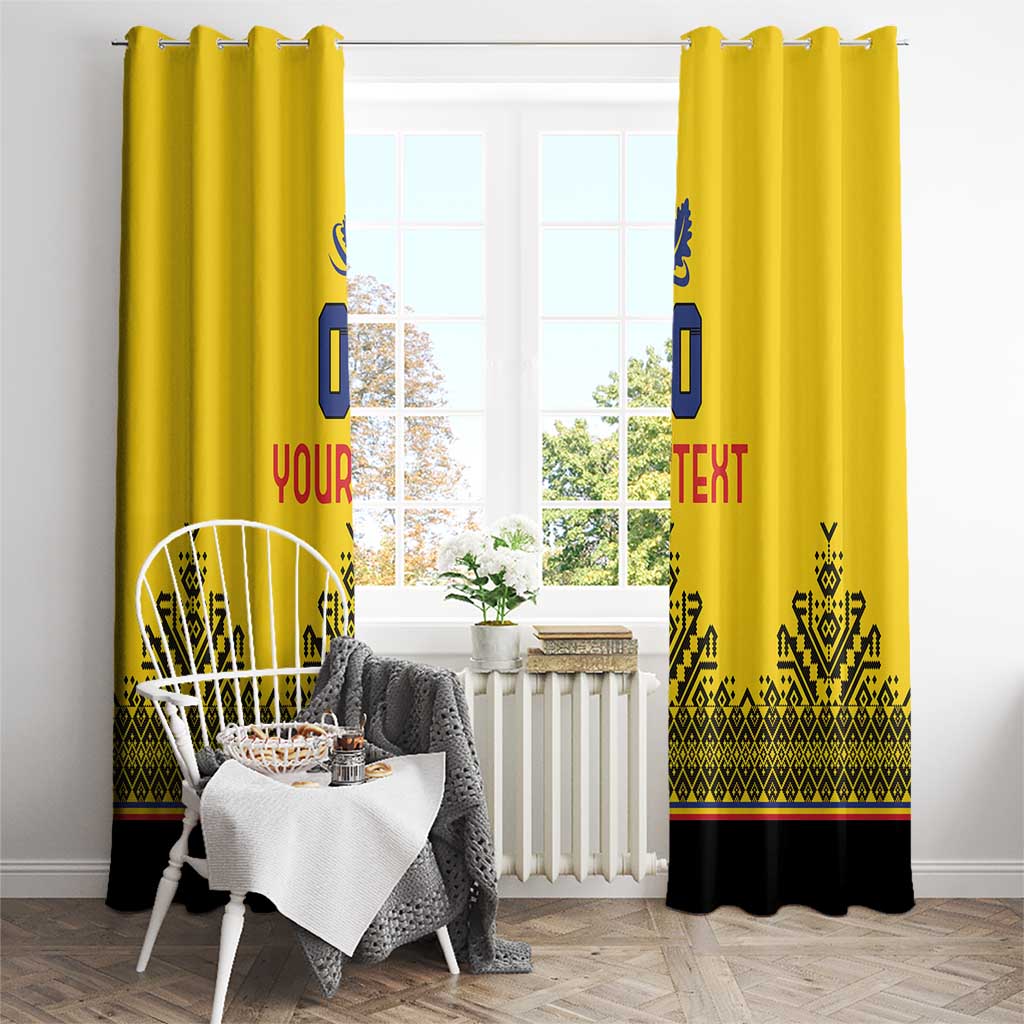 Yellow window curtains with blue emblem, red text, and black patterned hem