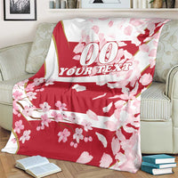 Custom rugby blanket in red with cherry blossom print and '00 YOUR TEXT' graphic