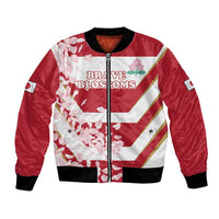 Red satin bomber jacket with zip front, black ribbed trim, cherry blossom print and stripes
