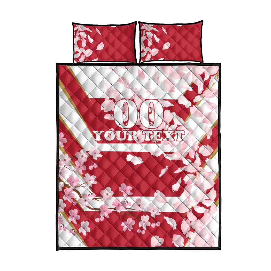 Quilt bed set with cherry blossom print, two pillowcases, 'YOUR TEXT' on cover