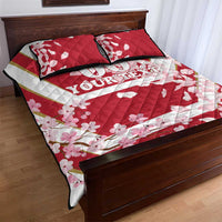 Red and white quilt bed set with cherry blossoms and 'YOUR TEXT' across the cover