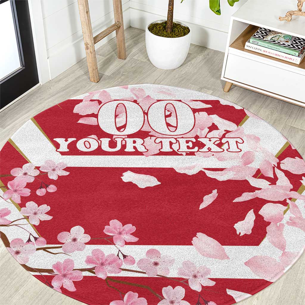 Red round carpet with pink cherry blossoms and custom text design