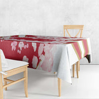 Red cherry blossom tablecloth with gold-striped section and pink petals, corner drape