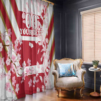 Red and white cherry blossom window curtain with custom text, hanging over the floor