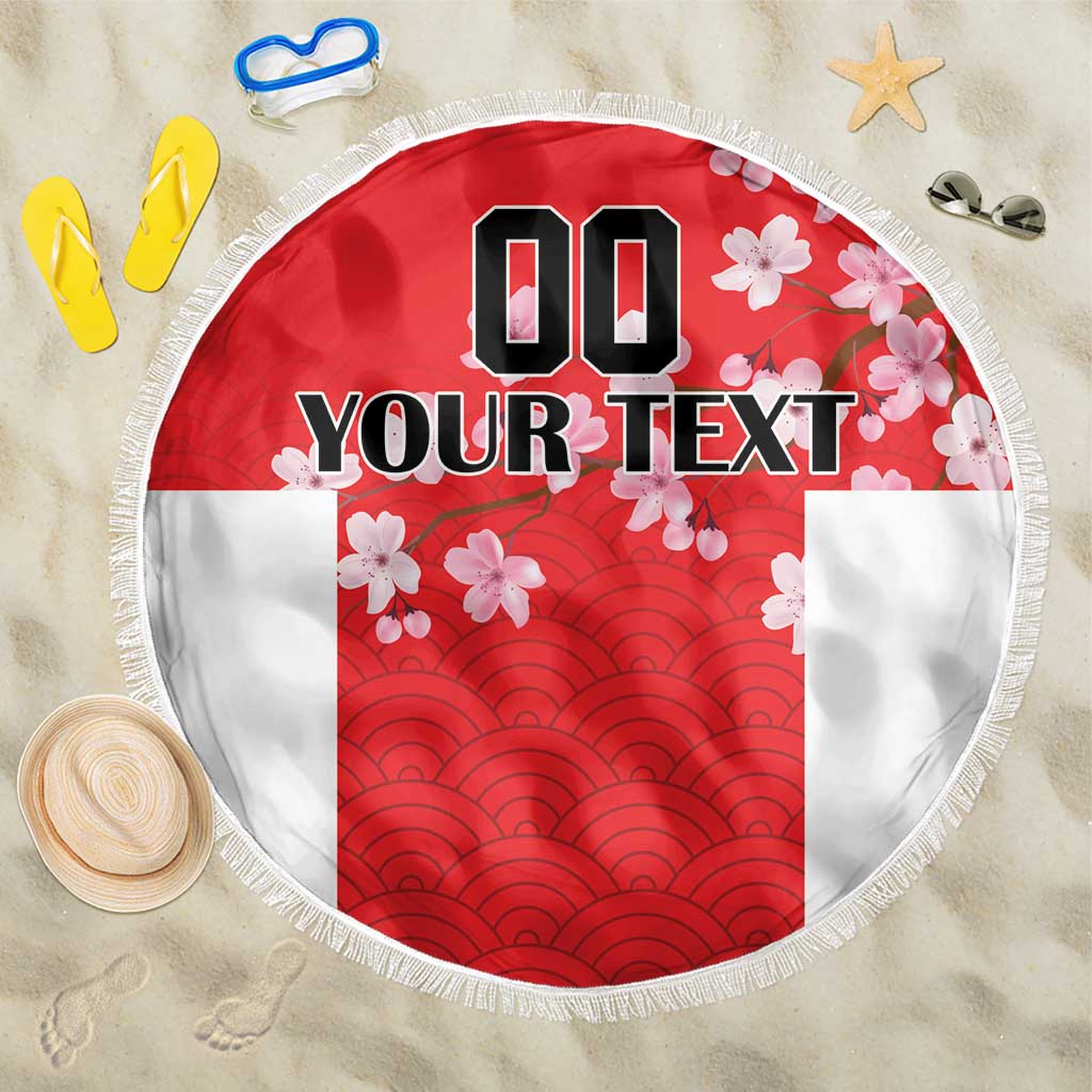 Red beach blanket with white fringe, wave pattern and cherry blossoms, custom text circle