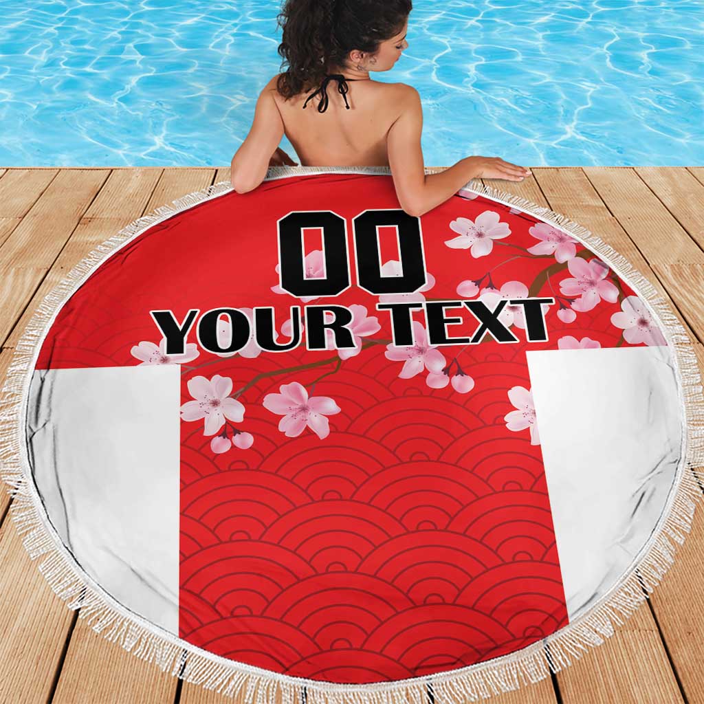 Round red and white beach blanket with fringe edge, wave ridges and cherry blossoms, custom text