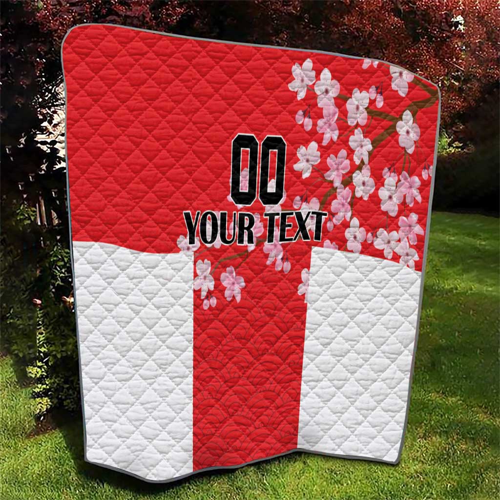Red and white quilt with quilted texture, Japanese waves and cherry blossoms, custom text