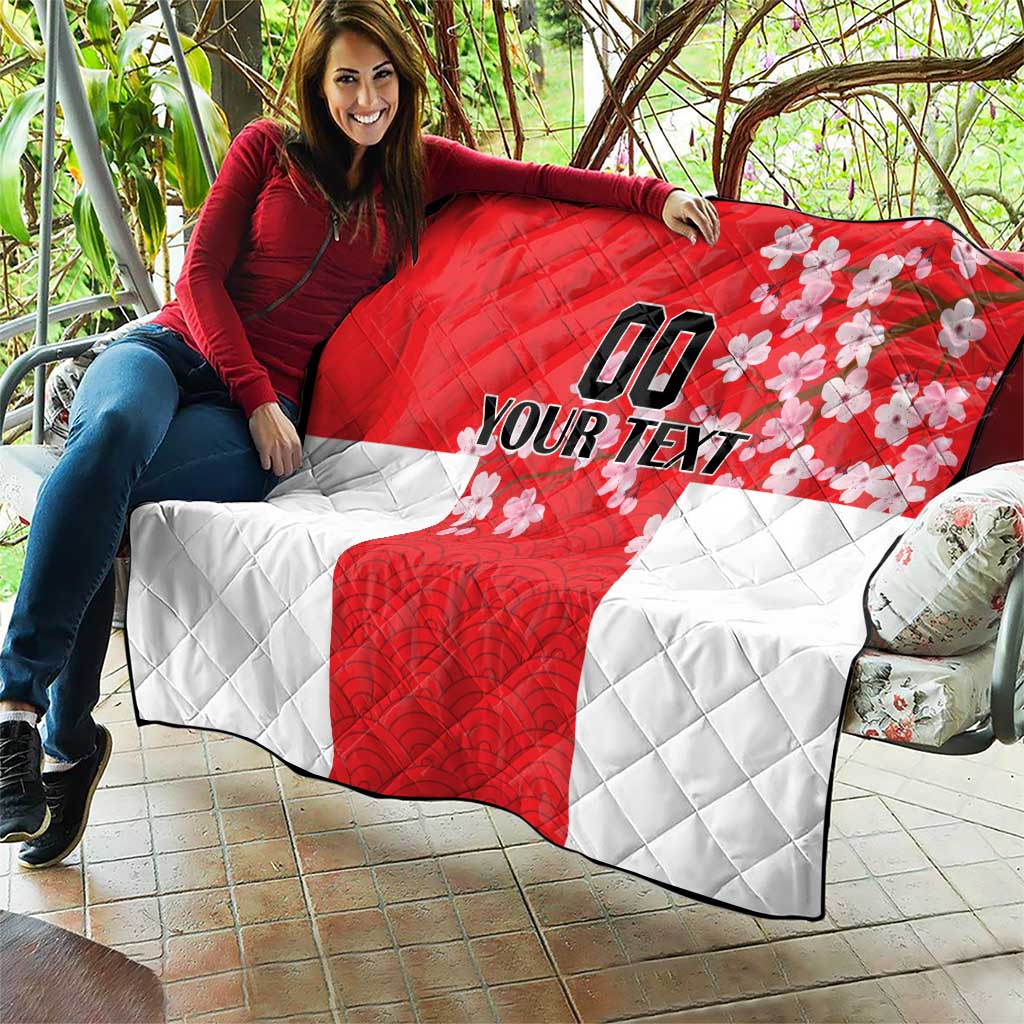 Red and white quilt draped on sofa, quilted texture, Japanese waves and cherry blossoms, custom text