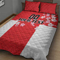 Red and white quilt bed set with Your Text graphic and pink flower accents