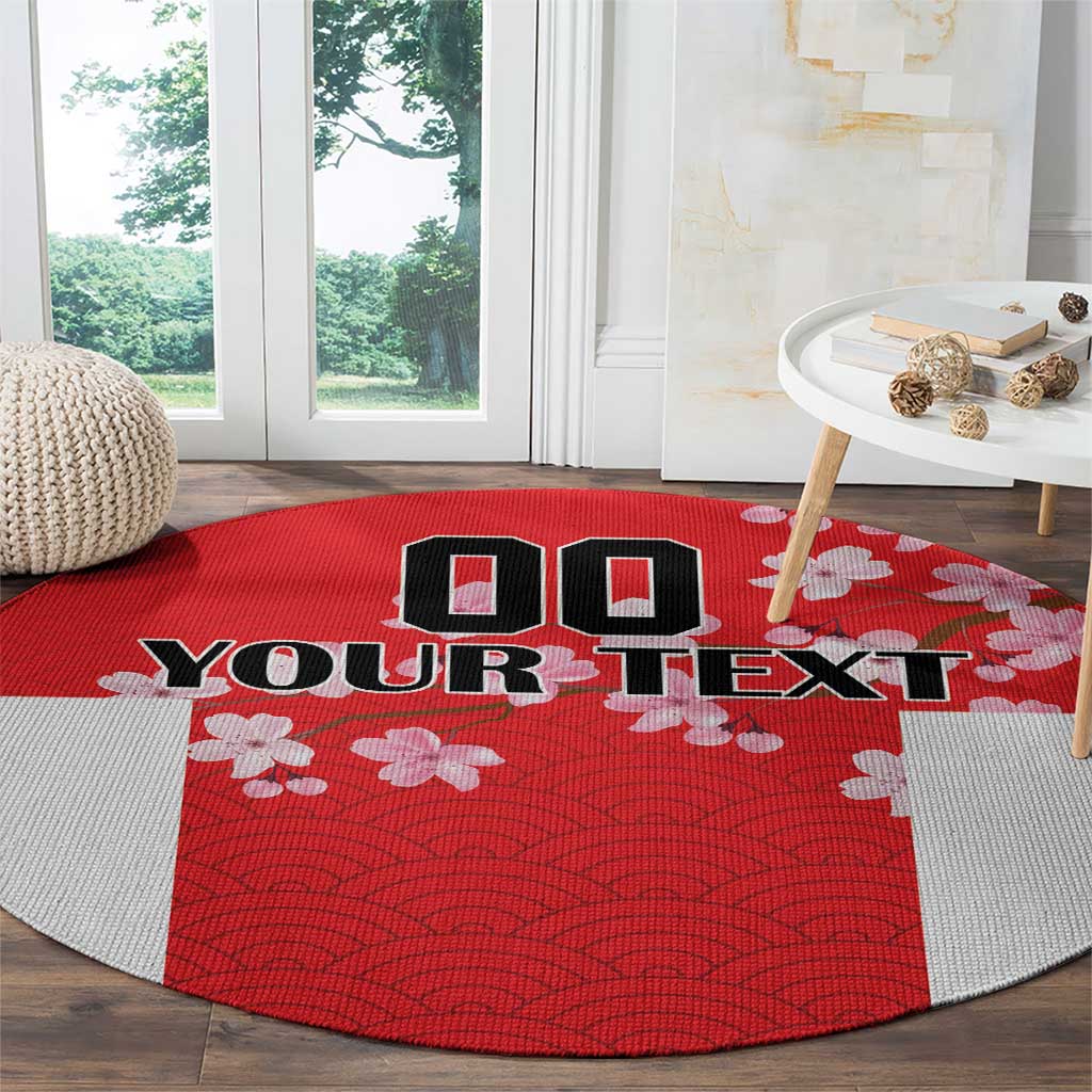 Red round rug with wave pattern and cherry blossoms, custom text in the center.