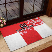 Red rectangular doormat with white panels, cherry blossoms, and layered wave design