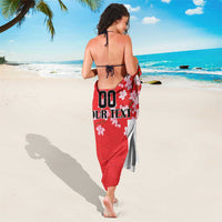 Red seamless sarong with wave pattern and cherry blossoms, tied hem and custom text