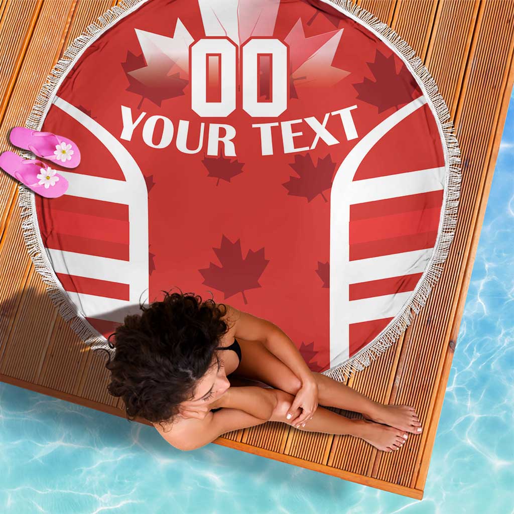 Red round beach blanket with '00 YOUR TEXT' and maple-leaf star graphics, fringed border