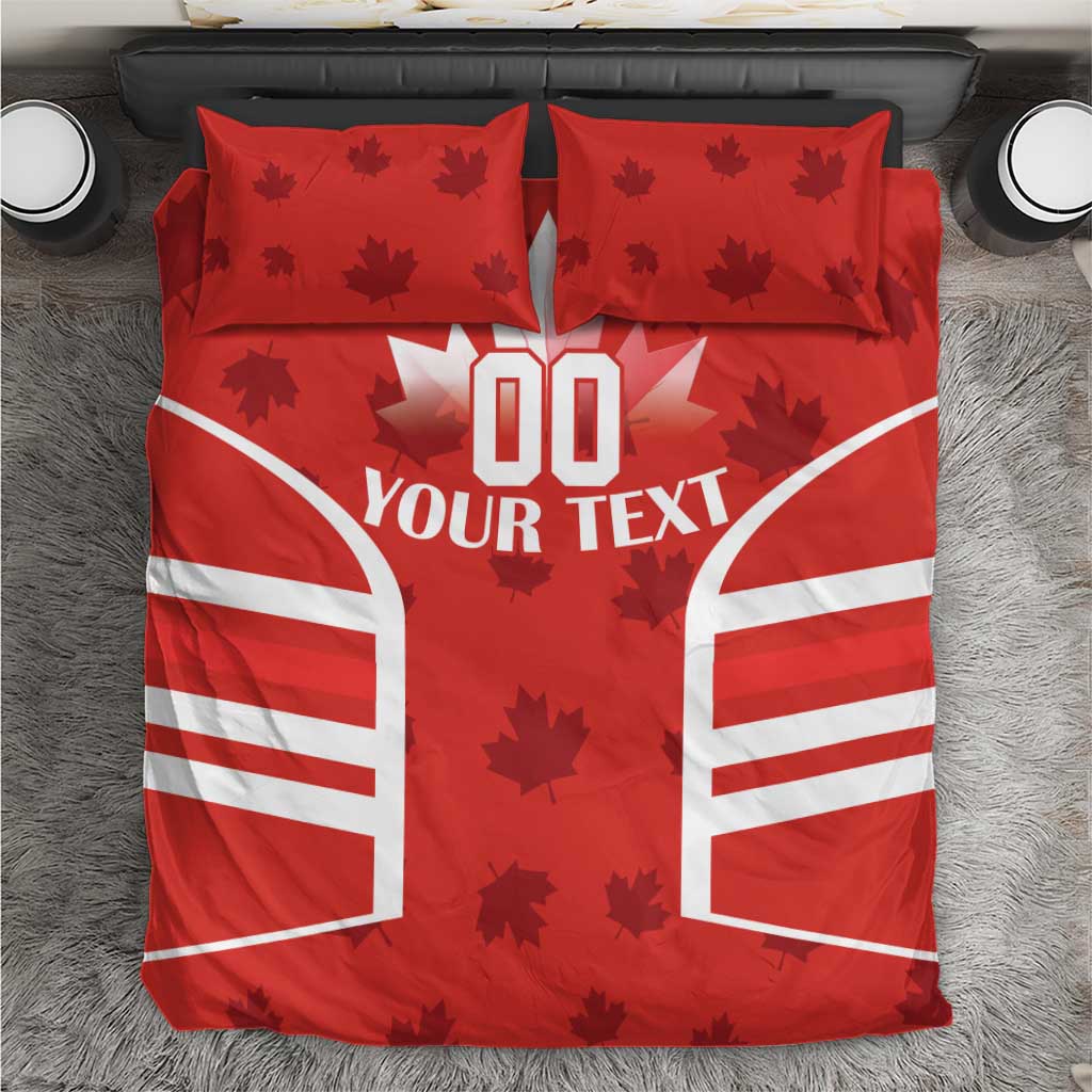 Red bedding set with maple leaves, rugby-style striped side panels, and 'YOUR TEXT' center