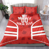 Red bedding set with maple leaves, rugby-style stripes, and 'YOUR TEXT' on duvet