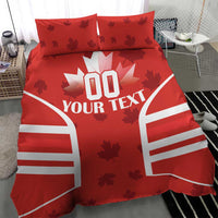 Red bedding set with maple leaves, rugby-style striped panels, and 'YOUR TEXT' duvet