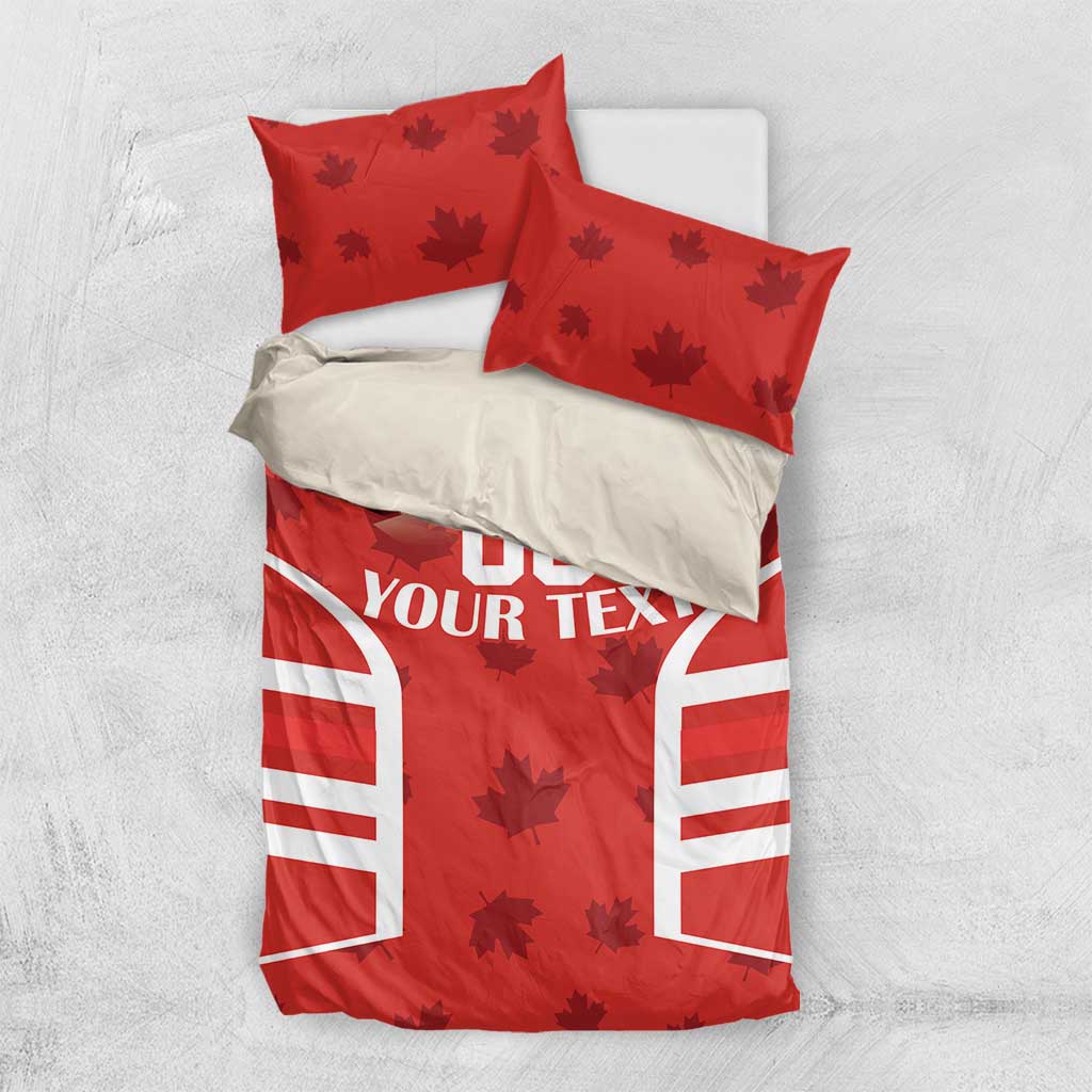 Red bedding set with maple leaves, striped panels, and 'YOUR TEXT' text on duvet