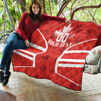 Red Canada rugby quilt blanket on outdoor seating with white maple leaf and YOUR TEXT