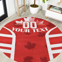 Red round rug with rugby jersey front graphic, white sleeve stripes, maple leaves and custom text