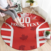 Red round rug, rugby jersey print with maple leaves, white stripes and custom text