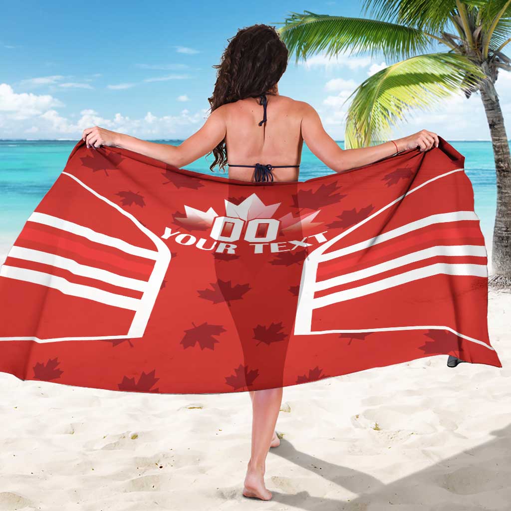 Red Canada flag sarong with maple leaf graphics and white striped panels, draped wide