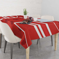Red Canada flag tablecloth with bold white stripes and maple leaf accents on table