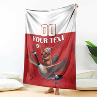 Red and white custom rugby blanket draped, featuring beaver riding goose and 'YOUR TEXT'