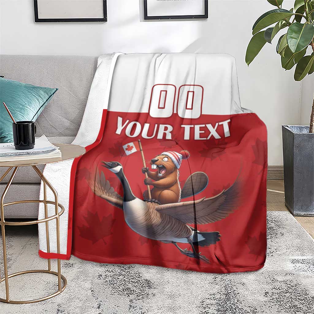 Custom rugby blanket over sofa arm, red center with beaver riding goose graphic
