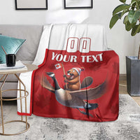 Custom rugby blanket over sofa arm, red center with beaver riding goose graphic