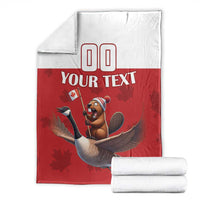 Custom rugby blanket folded with beaver riding goose design and 'YOUR TEXT' on red