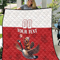 Red and white quilt with diamond stitching, custom 00 and text, beaver-riding goose graphic