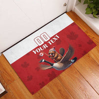 Red and white custom rubber doormat with beaver riding a goose under maple leaves