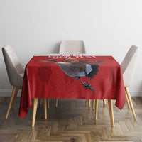 Red rectangular tablecloth with centered goose graphic and maple leaf shapes