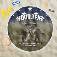 Round navy beach blanket with white fringe, stars and 'YOUR TEXT' over soldier graphic