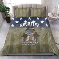 Personalized olive camo bedding set with blue stars, central “YOUR TEXT” print and pillows
