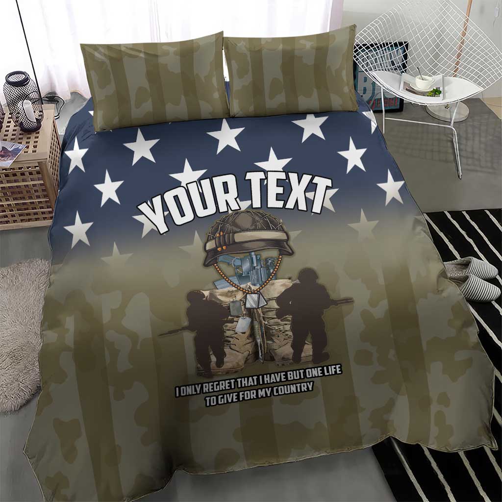 Personalized olive camouflage duvet with blue star top and “YOUR TEXT” graphic; pillows