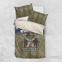 Personalized bedding set viewed from above: olive camo, blue stars, “YOUR TEXT” duvet