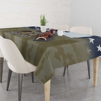 Veterans Day tablecloth with olive camo pattern and navy star accents across tabletop
